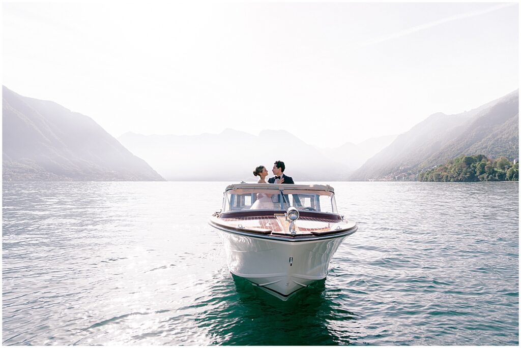 Bride and groom sailing on a boat on Lake Como, Italy