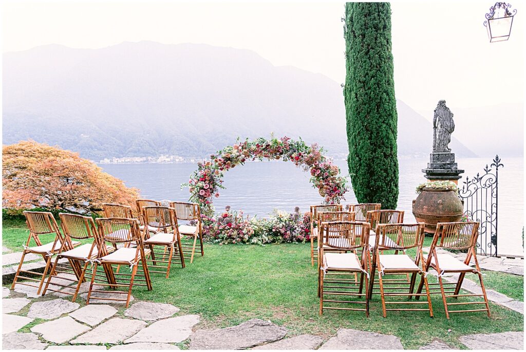 Wedding ceremony set up at Villa La Cassinella, Lake Como with floral arch and chairs