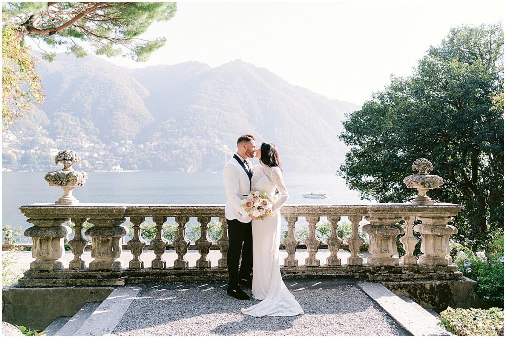 Bride and groom kissing after wedding at Villa Pizzo, overlooking Lake Como