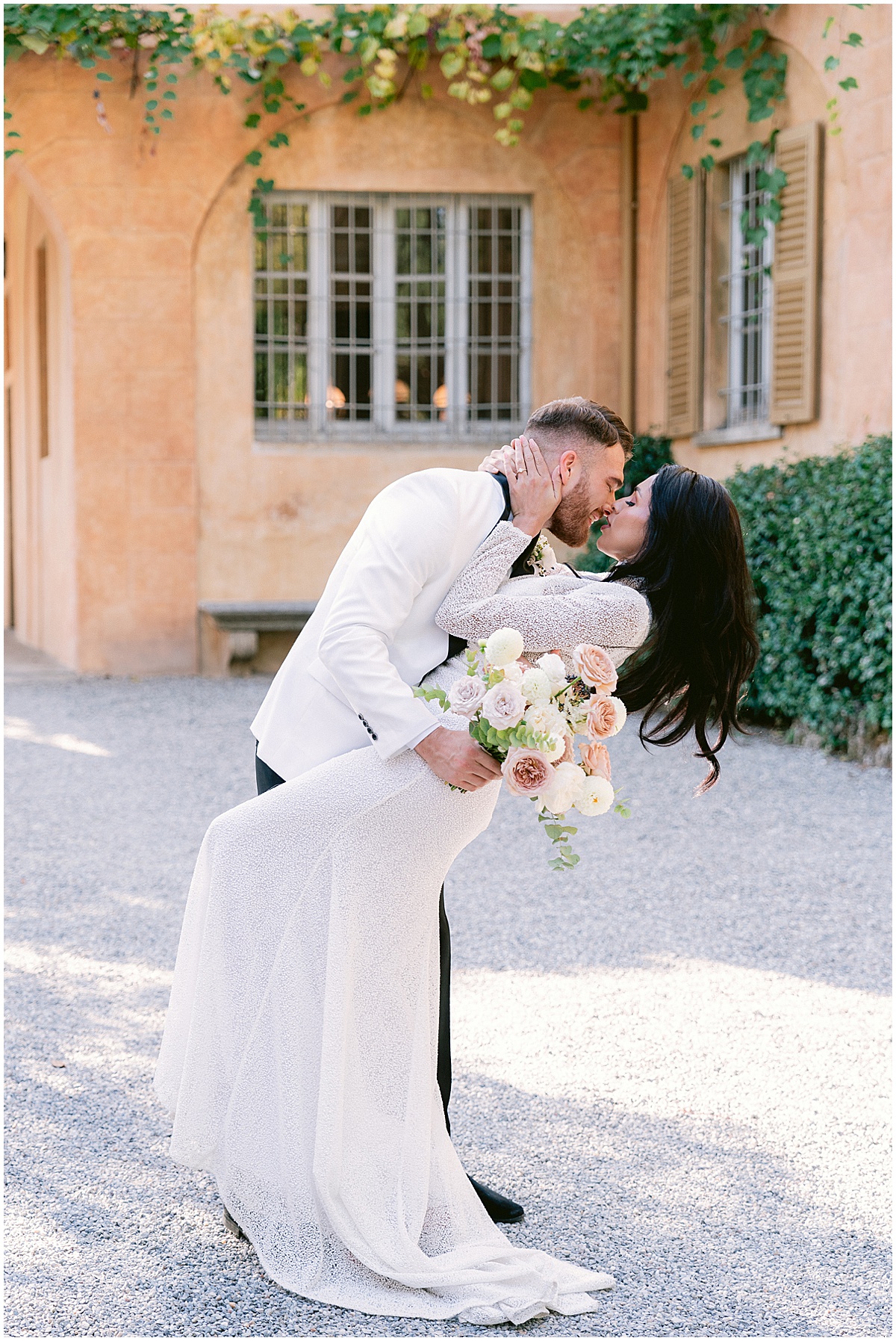 Bride and groom kissing at Villa Pizzo Lake Como wedding